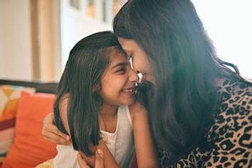 Mother and daughter hugging