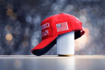 Red MAGA hat on a can