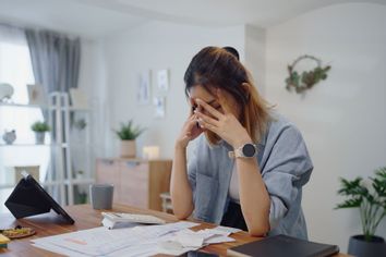 Woman stressed out with her finances