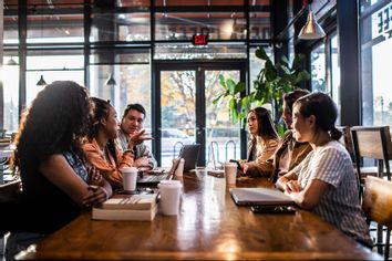 Young professionals collaborating in coffeeshop