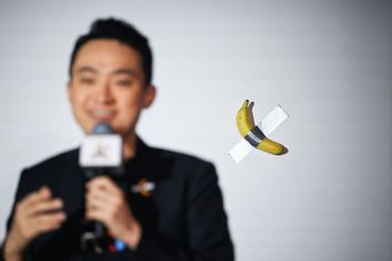 Comedian banana taped to wall artwork