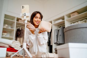 Fashion blogger influencer, showing off her belt and handbag