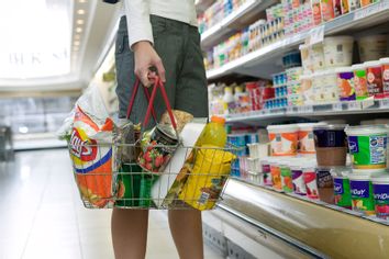 Young woman shopping in supermarket