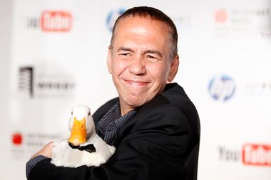 Comedian Gilbert Gottfried arrives with a duck at the Webby Awards in New York