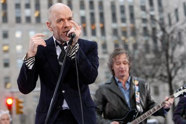 The band R.E.M. with lead singer Michael Stipe performs on the plaza of Rockefeller Center in New York