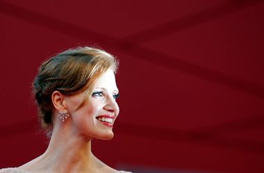Actress Chastain poses for photographers as she arrives on the "Wilde Salome" red carpet at the 68th Venice Film Festival