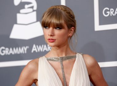 Singer Taylor Swift arrives at the 55th annual Grammy Awards in Los Angeles