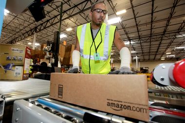 Image for Jeff Bezos deemed richest man in world while Amazon warehouse workers suffer grueling conditions
