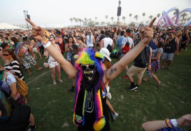 A concertgoer dances during the performance by Kid Cudi at the Coachella Valley Music and Arts Festival in Indio