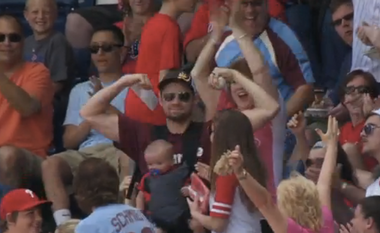 Image for The world's coolest dad just barehanded a foul ball with a baby strapped to his chest