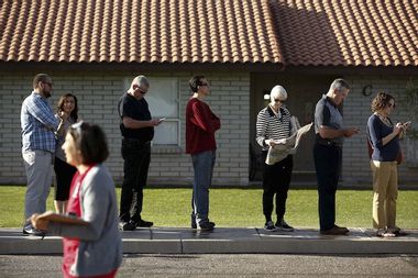 People wait to vote in U.S. presidential primary election outside polling site in Arizona
