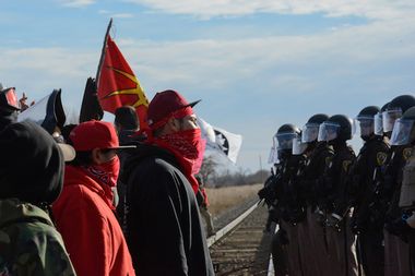 Protesters face off with police during a protest in Mandan against plans to pass the Dakota Access pipeline near the Standing Rock Indian Reservation, North Dakota