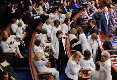 Democratic women in white during Trump's speech