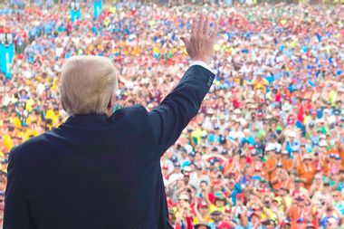 Donald Trump waves after speaking to Boy Scouts during the National Boy Scout Jamboree