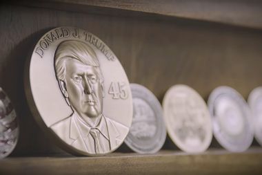 Image for Trump touts manufacturing initiative with video showing workers making coins with Trump’s face