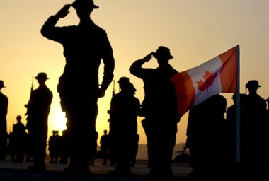 Canadian Army officers salute Flag