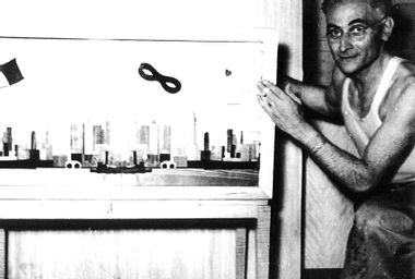 Adolpho Baldizzi with a cabinet he made.