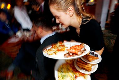 Waitress with breakfast plates