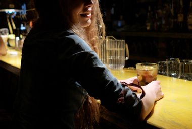 Girl sitting at a bar