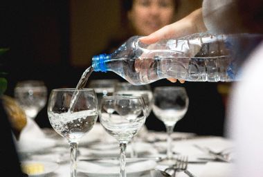 Pouring water in a restaurant