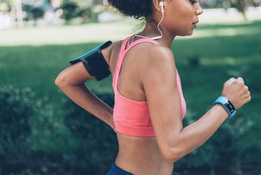 Woman Jogging wearing Technology