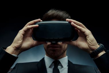 Businessman Wearing Virtual Reality Goggles