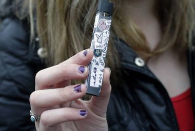 Teen Holds Vape