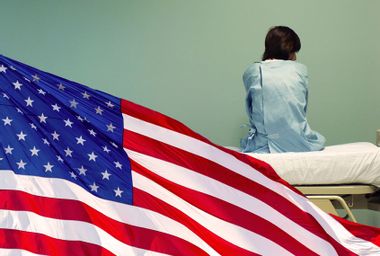 American Flag; Woman sitting on a hospital bed