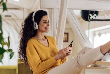 Young woman listening to a podcast