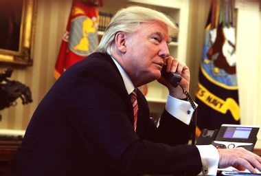 Donald Trump on the phone in the Oval Office