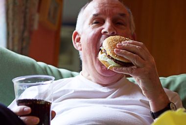 Man Eating a Burger