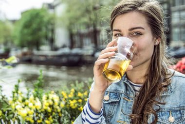 Woman drinking glass of beer