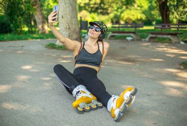 Woman takes a selfie on a break from rollerblading