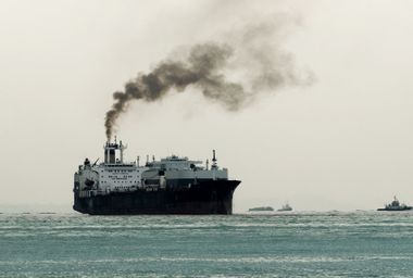 Ship with thick black sooty exhaust