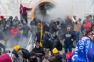Police use tear gas around the U.S. Capitol building where pro-Trump supporters riot on Jan. 6, 2021.
