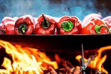 Red bell peppers on barbecue tray