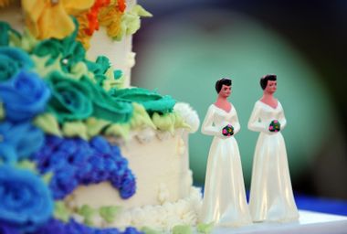 Wedding cake decorated with figures of two brides