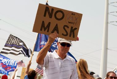 Protesters rally against a mask mandate