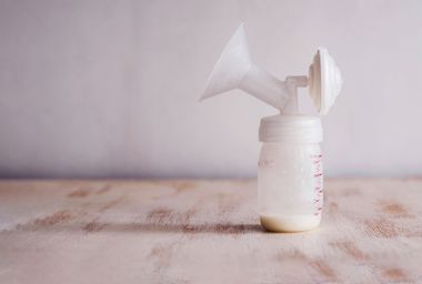 Fresh breast milk in the breast pump milk container