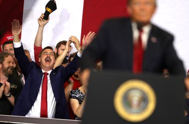 MyPillow CEO Mike Lindell cheers as then-President Donald Trump speaks to supporters during a campaign rally.