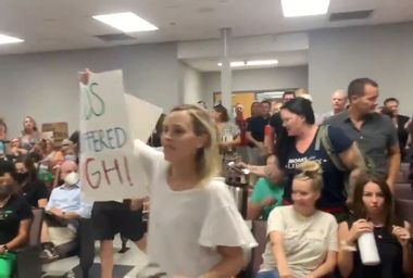 Dozens of enraged anti-mask parents followed an unruly man out in a mob at the Williamson County Schools meeting, Tennessee.