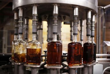 Bottles of single barrel bourbon are filled on the bottling line at a distillery