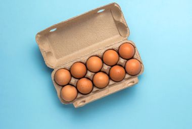 A cardboard carton with ten eggs