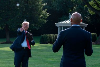 President Donald Trump, left, plays ball with Mariano Rivera, the MLB Hall of Fame closer from the Yankees, during a Major League Baseball Opening Day event at the White House in Washington, DC, on July 23, 2020.
