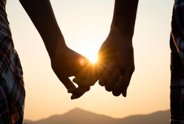 Silhouette Couple Holding Hands During Sunset