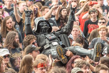 Heavy metal fan dressed as Darth Vader crowd surfs at Bloodstock Festival 2021