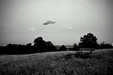 UFO in flight above urban park