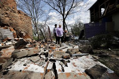 Ukrainians clear debris and search for usable material after the Russian attacks