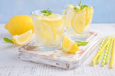 Cold refreshing summer drink with lemon and mint