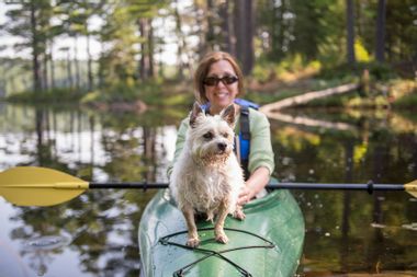 Woman Kayaking with her Dog
